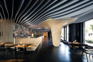 Plafond acoustique Texaa Stéréo design ondulé noir dans salle de réunion moderne - Traitement phonique professionnel par IRIS Connect pour réduction de bruit et confort acoustique